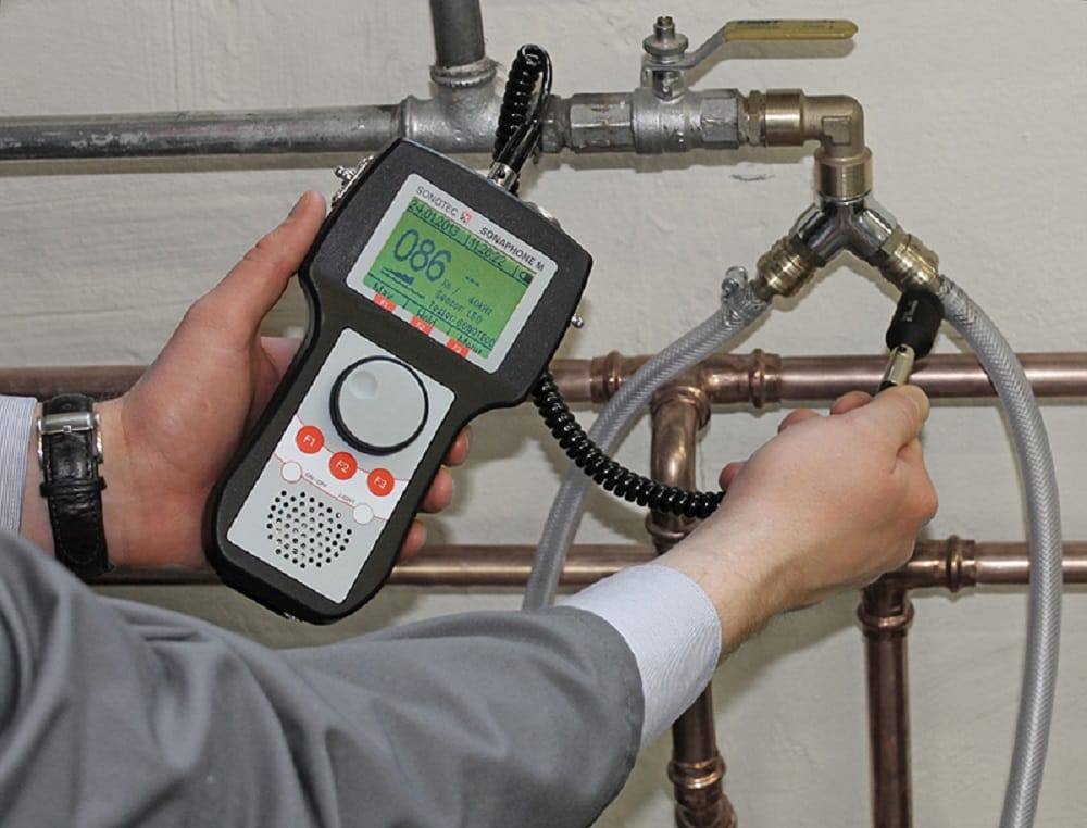 Plumber testing pipes with electronic leak detection equipment in Lake Worth Beach
